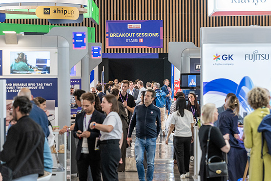 Visitors in the aisles between the exhibition booths