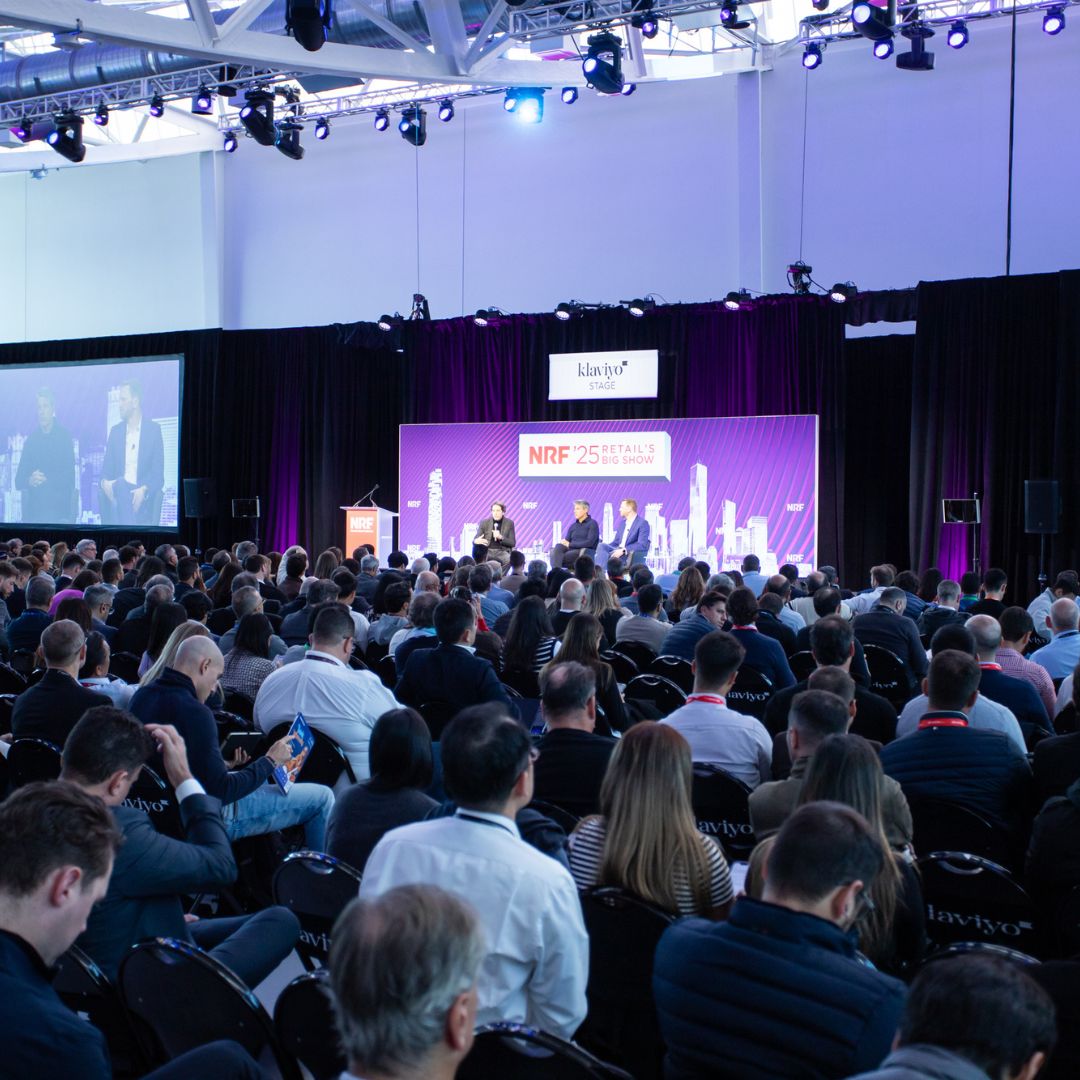 Conference session at NRF bringing together a large audience of retail professionals for inspiring discussions on industry challenges.