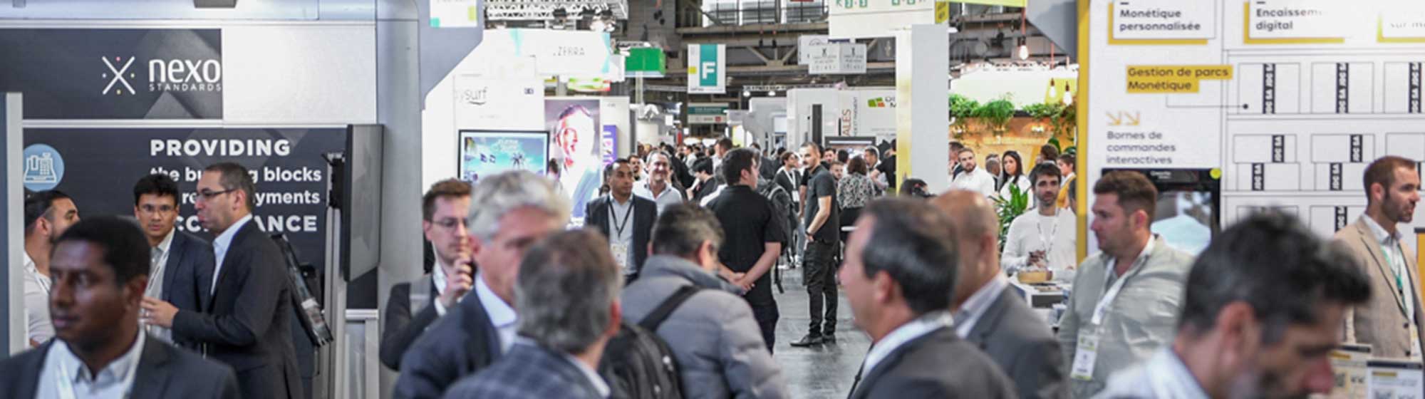 group of people in the aisles of Paris retail Week